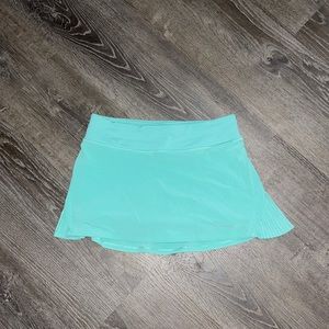Lululemon tennis skirt with build in shorts and a zipper pocket on the back